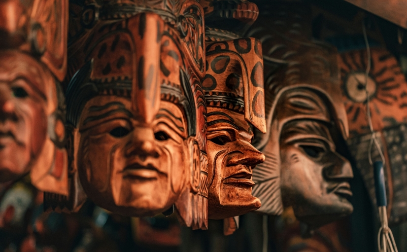 Closeup of wooden statues with carved faces. Artifacts in Guatemala